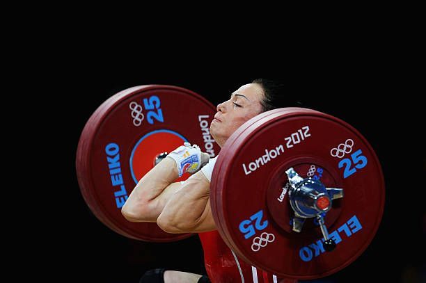 LONDON, ENGLAND - JULY 29: Cristina Iovu of Republic of Moldova competes in the Women's 53kg Weightlifting on Day 2 of the London 2012 Olympic Games at ExCeL on July 29, 2012 in London, England. (Photo by Laurence Griffiths/Getty Images)